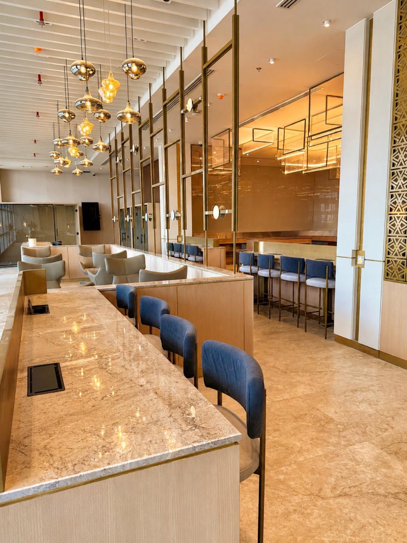 Marble café counter with upholstered stools